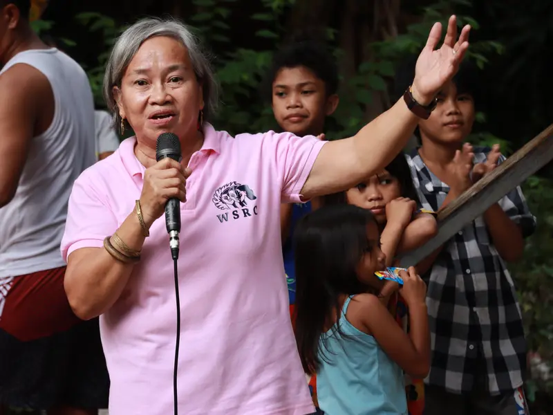 WSRC staff member speaking with microphone at a community event